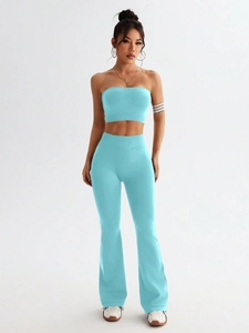Detailed view of light blue ribbed knit texture on high waisted seamless yoga flare pants