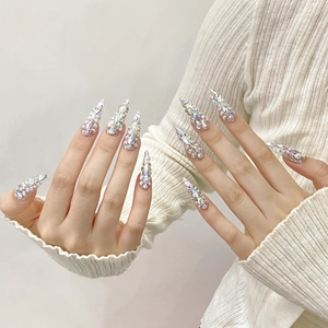Handmade stiletto press-on nails with full crystal rhinestones and Cleopatra glam style