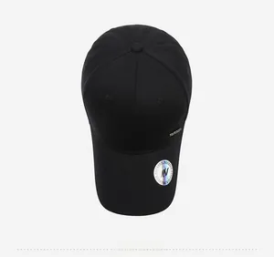 Top view of black baseball cap showing classic 6-panel crown and metal logo detail