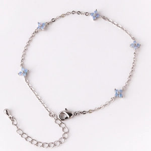 Silver thin chain bracelet featuring six light blue four-leaf flower charms and lobster clasp