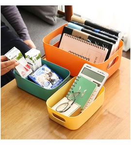 Colorful plastic storage baskets with handles for organizing books and snacks on desk