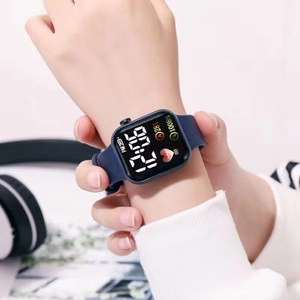 Detail view of square LED electronic watch showing fitness tracking data on blue silicone strap