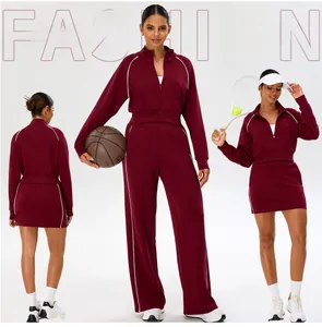 Detail view of burgundy 5-piece yoga set with zipper jacket and wide-leg sports pants