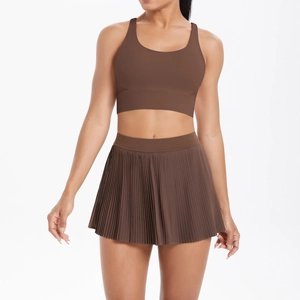 Detail of dark brown seamless sports bra and pleated mini skirt set for fitness
