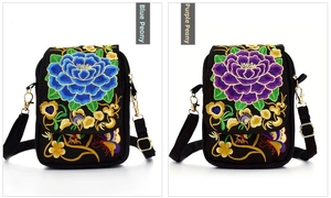 Close-up of blue and purple peony embroidery details on black ethnic crossbody bags