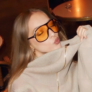 Fashionable oversized orange wrap-around sunglasses with stylish T-shaped metal hinges