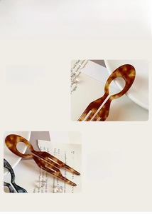 Detail of tortoise shell U-shaped hair pin made from premium amber acrylic material
