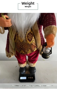 Detail of 24-inch Santa doll in gold star velvet robe showing weight of 823.5g