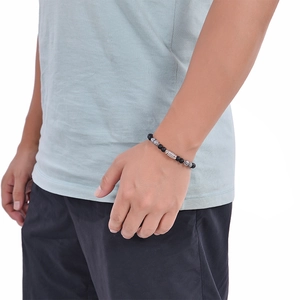 Detail of 6mm obsidian and tiger eye beaded bracelet on male wrist with OT clasp