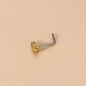 L-shaped gold nose stud featuring heart design with red gemstone and clear zircon accents