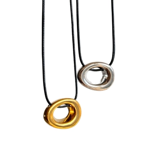 Minimalist 18k gold and silver oval pendant necklaces with black cord chain