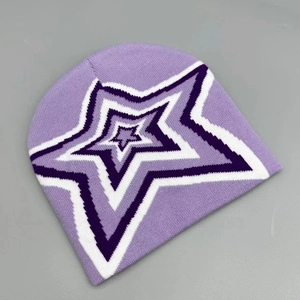 Detailed close-up of light purple knitted beanie with a layered star embroidery pattern
