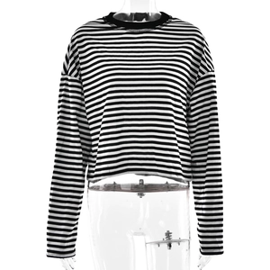 Detailed close-up of the black and white striped long sleeve top with a crew neck finish