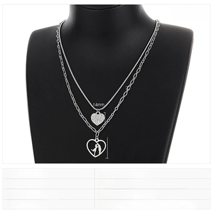 Detailed view of layered heart pendants on a necklace with precise dimensions shown