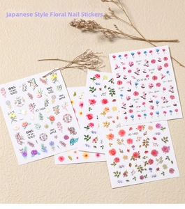 Detail of floral nail art stickers featuring roses and wild flowers in Japanese style
