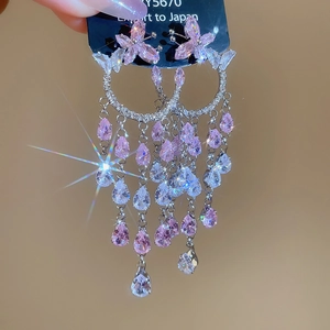 Détails de boucles d'oreilles fleurs en argent avec pampilles de cristal rose