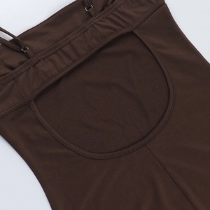 Close-up of dark brown bodycon dress with backless design and elastic knit texture