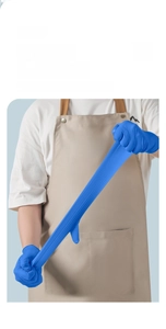Close-up showing the high elasticity and durability of blue nitrile cleaning gloves