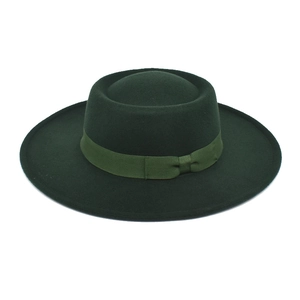 Close-up of dark green wool felt fedora with matching grosgrain ribbon and bow detail