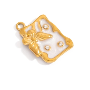 Macro detail of 18K gold-plated rectangle butterfly charm with white enamel and zircons