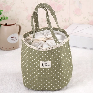 Polka dot canvas lunch bag with lace trim and drawstring closure in green cotton linen