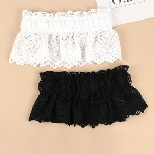 Detailed close-up of white and black floral lace garter belts with scalloped edges