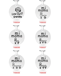 Macro view of round titanium steel pendants with Love You Grandma and family engravings