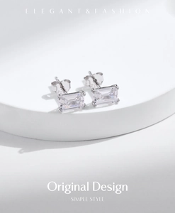 Macro shot of 925 sterling silver emerald cut stud earrings on white display
