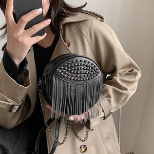 Fashionable black round crossbody bag with metal rivets and fringe tassels for women