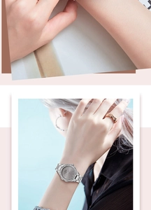 Detail showing women's silver watch with diamond bezel and grey sunray dial on wrist