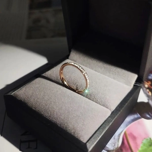 Elegant rose gold titanium steel ring with sparkling small diamonds in a black velvet box