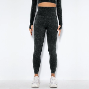 Detail of acid wash texture on seamless high waist yoga leggings and long sleeve crop top