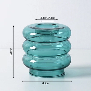 Detailed view of dark green glass vase with dimensions: height 8.5cm and width 8.5cm