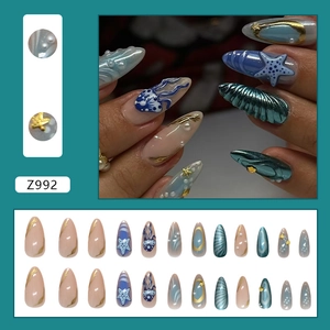 Ocean theme press-on nails with blue sea shells and 3D starfish charms in 24 piece set