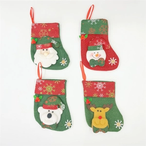 Set of 4 mini Christmas stockings featuring Santa, Snowman, Reindeer, and Bear ornaments