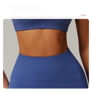 Detail of high-waist yoga pants featuring ribbed waistband for tummy control and slimming effect