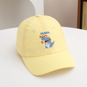 Detail of yellow kids baseball cap featuring breathable laser-cut holes and dinosaur embroidery