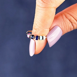 Anxiety relief spinner ring with colorful enamel beads on silver stainless steel band