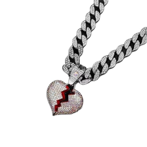 Iced-out broken heart pendant necklace in silver alloy with red crack detail