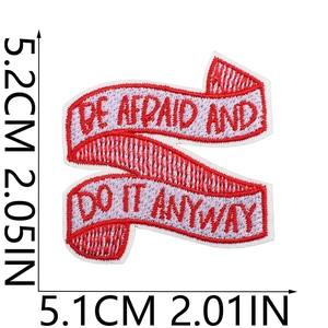 Detail of embroidered motivational patch 'BE AFRAID AND DO IT ANYWAY' with size measurements