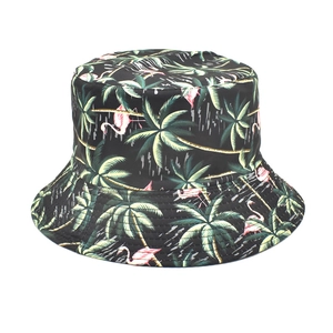 Detail of black bucket hat featuring tropical palm tree and pink flamingo patterns