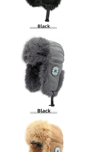 Detail of warm winter trapper hats in black, grey and khaki with plush fur lining and chin strap