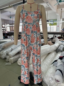 Detailed view of floral print camisole jumpsuit with wide leg design on mannequin