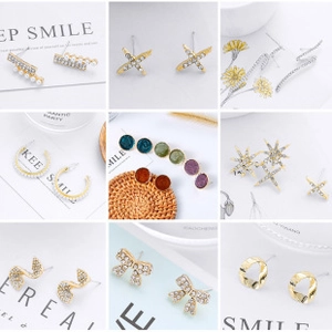 Macro shot of assorted acetate and rhinestone stud earrings in a variety of styles