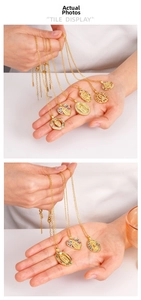 Detail of copper gold plated Virgin Mary pendants with colorful inlaid zircon stones