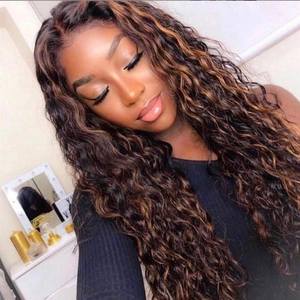 Detail of long curly wig with deep brown hair and golden highlights on lace front