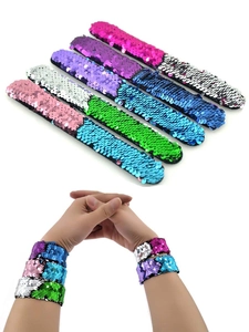 Detail of reversible sequin slap bracelets showing colorful flip effects for kids
