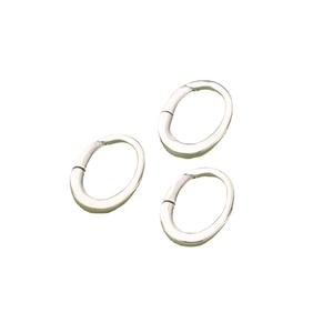 Three rhodium-plated silver oval lobster clasps for jewelry making on white background