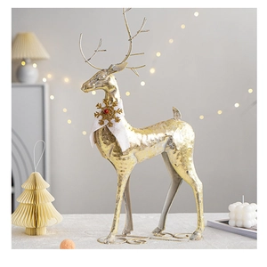 Detailed close-up of a golden metal Christmas reindeer with a white winter scarf decor