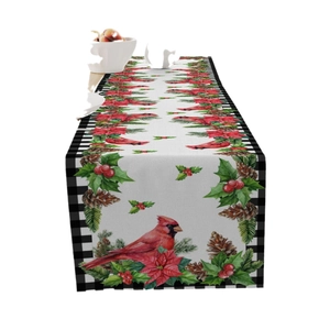 Christmas linen table runner with cardinal and poinsettia patterns for festive decor